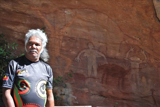 One of the Elders takes us to the Split rock site of the cave paintings.