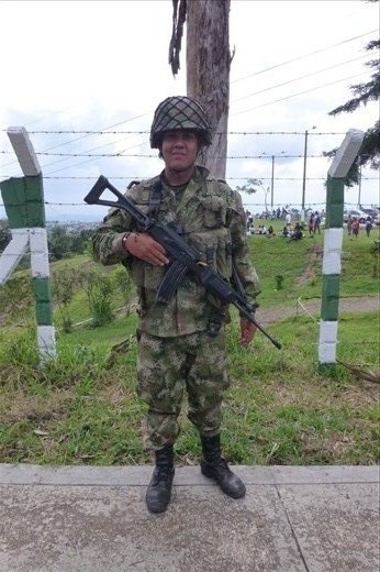 I was trying to take a picture of this soldier while he was bowing to us with hands in prayer after we told him where we cycled from, but he wouldn't do it again. He wanted to be photographed like this and no other way!