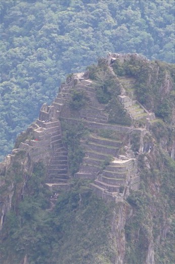 The mountain behind Machu Picchu Huayna Picchu and it's ruins.