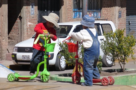 Two Punos on their scooters.