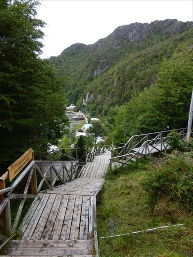Caleta Tortel is a lumber town with an intricate walkway system built by the town’s inhabitants which run several kilometres around the cove (“caleta”). Without these walkways, the only way to communicate and travel between houses would be by boat, given the density of the vegetation and the steepness of the hills around the cove.[6] The walkway system has become part of the town’s culture and a local tourist attraction.