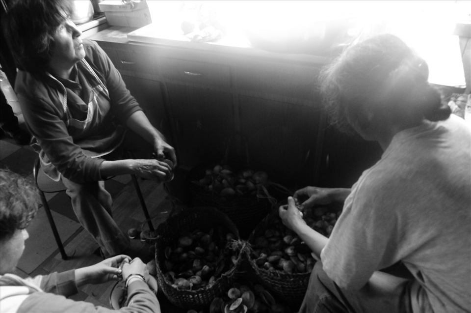 People of the island peeling potatoes