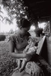 Amidst the humid weather, the baby sleeps soundly in her mother's arms.: by marielle, Views[256]