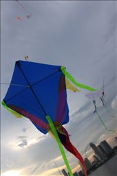Kites through heaven. Someone keeps adding hundreds kites on the thread until himself even can not see the end of his kite. Soaring up the sky, these colorful kites look like beads woven in the sky, wriggle in the wind. : by marinabarragesingapore, Views[467]