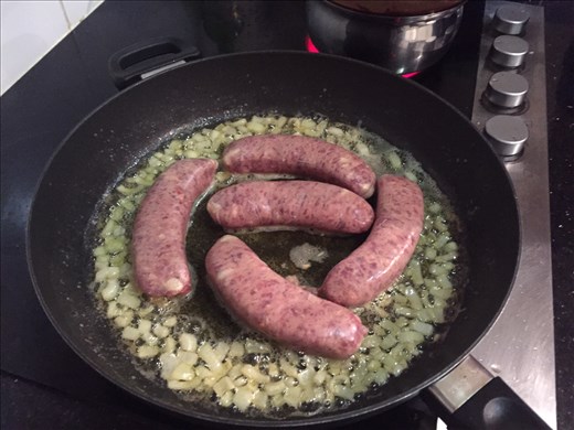 Sauteing onion and searing sausage