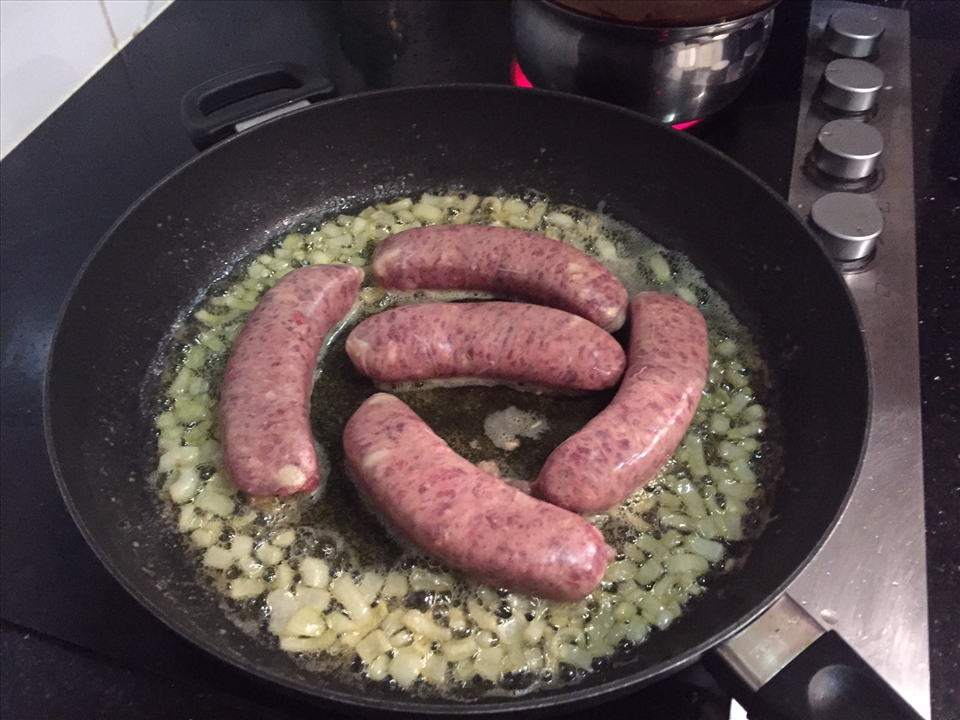 Sauteing onion and searing sausage