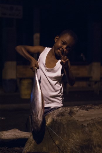 It all began with one illusion to buy one and the most advanced camera soon proved to be scam, then i thought going to fetch in this place to know , but i had consigned without traveling and i realized that stolen me,all it would be strange because something drew me travel there and i began to save so i needed to transport with to 12 dollars more , some cans of tuna and my equipment , to arriving i get to decided to capitalize and i met some people and i obtain one boat to going to village but i hadn't have heard there but the same  day some people, recommended me to ask, to get him to allow me to stay in office parks and so began.
It's my first day in the village ,later i making some friends playing football in the beach so i saw one child assuming the final score and trophy with him dad in one competition of fishing , they said me in this week had had a few fish , dad asked me one portrait and i couldn't resist for this charism that characterizes this people and i did some photos as well child smiled me and he demonstrated happiness for trophy and play . Not only was made some photos ,i understood one thing its important for the furthermore i spent many hours to speak with they , for my fortune was not tourist season , so  gave me more time , so i decided capture the rutine , culture and life .