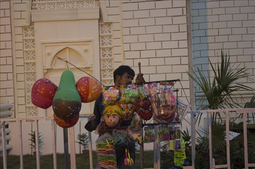 Though this festival comes with great happiness & fun but to some people, like Sukanta here, this festival is one of the biggest source of their income by selling balloons, whistles, toys, etc. They leave their family, their village in the whole puja session to return with money to buy happiness. 