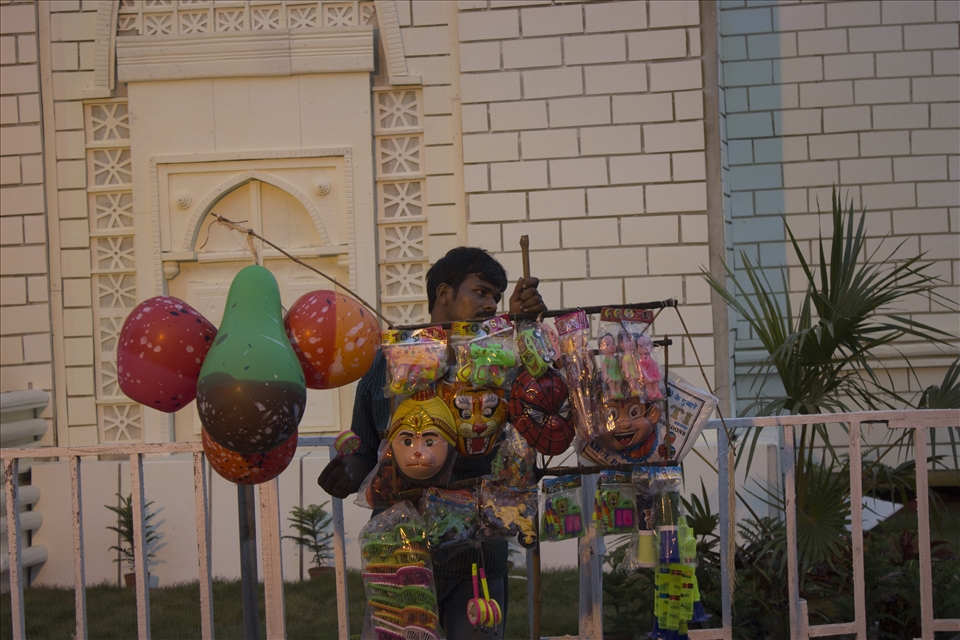 Though this festival comes with great happiness & fun but to some people, like Sukanta here, this festival is one of the biggest source of their income by selling balloons, whistles, toys, etc. They leave their family, their village in the whole puja session to return with money to buy happiness. 