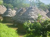 A young indigenous girl shelters herself from foreign visitors behind a hut: by mattadventures, Views[373]