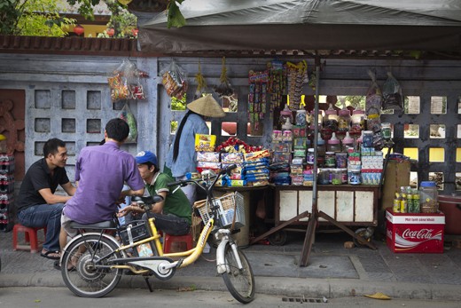 Street stalls throughout Vietnam not only sell an array of goods they also act as a place to socialize. After a hard day selling on the streets themselves, workers often spend hours at a time hanging around stalls like this, playing cards, drinking, laughing and catching up on all the days gossip.