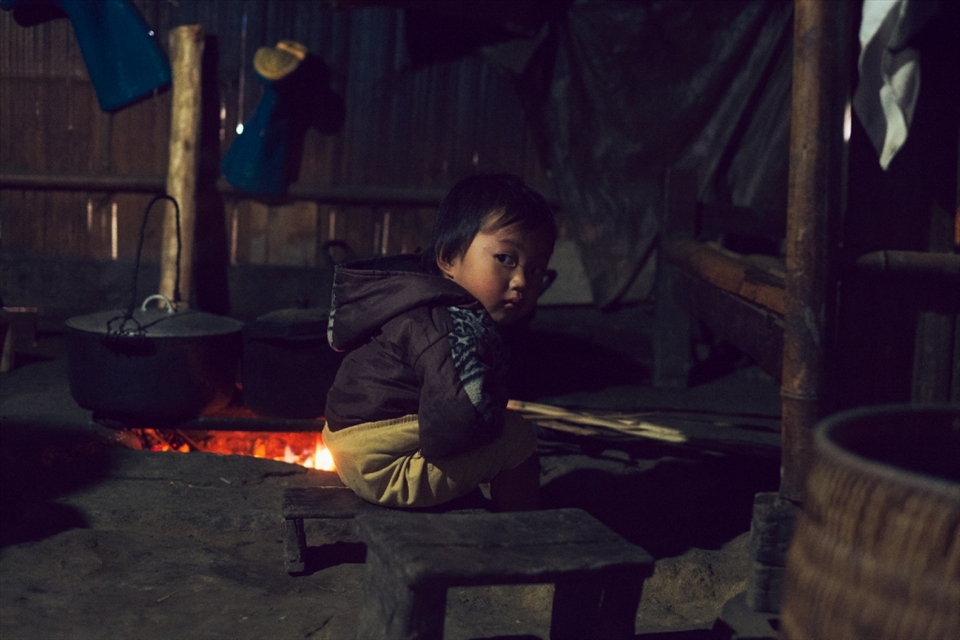 A young boy of some local Hmong women we met. They invited us back to their straw-built home and cooked us food with their stove that is a hole in the stone ground. 