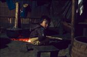 A young boy of some local Hmong women we met. They invited us back to their straw-built home and cooked us food with their stove that is a hole in the stone ground. : by mattchuang, Views[279]