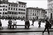 A tourist couple embrace, while soaking up the square’s atmosphere from the comfort of bench. Florence, Italy.: by mattdenn, Views[728]
