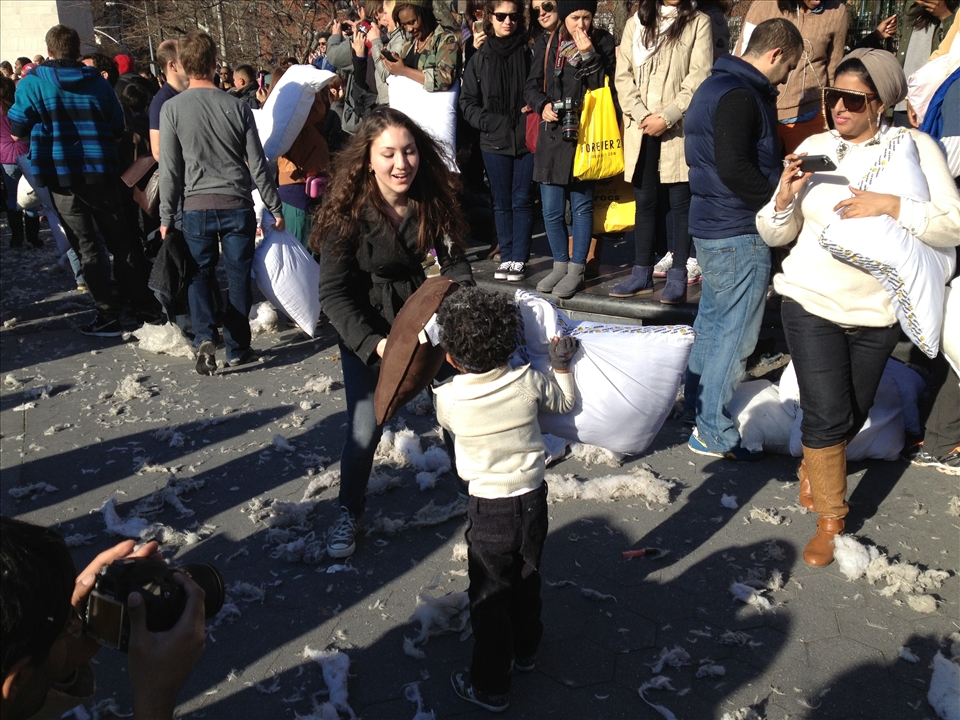 Washington Square Park is the site of many strange and otherwise unimaginable activities. Here locals of all ages knock around strangers in cushiony combat at the annual New York City pillow fight. Feathers fly and the remnants of busted pillows litter the ground, while some participants make battle clad in custom costumes.