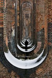 
For many years of my life I had ridden over this bridge going between Brighton and London. This picture was taken the very first time I had ever seen it from the ground, where my friend Oli and I climbed onto it, and gazed straight down to what seemed like a near infinite passage. This is the Balcombe Viaduct on the outskirts of Haywards Heath, in the United Kingdom, in one of those still functioning and wonderful examples of British engineering.: by matthewcoleman, Views[176]