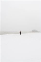 My friend Alistair and I were working together in Brighton when a sudden flurry of snow started falling down upon Brighton. On our lunch break we cut out of the office and headed to the beach. Once there, in a spontaneous moment, Alistair started running wildly towards the ocean, his arms aloft and waving in the excitement of the moment as the West Pier loomed in the background like an ominous shadow.: by matthewcoleman, Views[183]