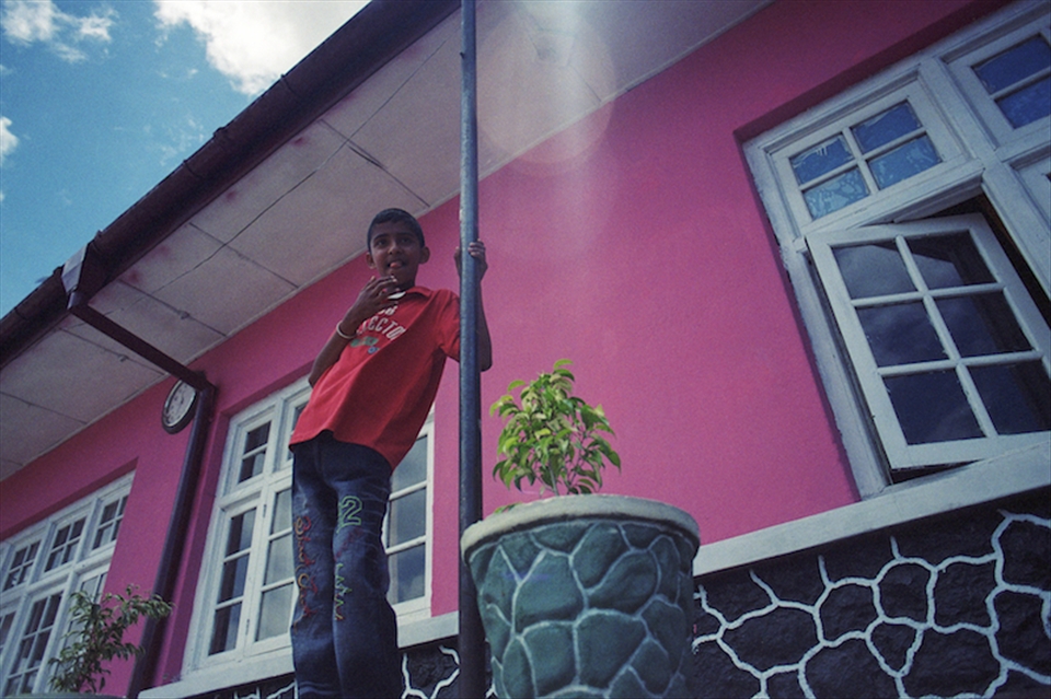 Boy at the station, selling tickets to passers by