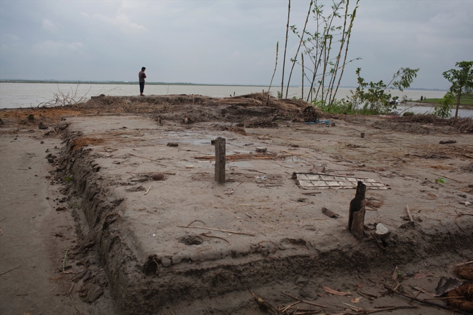 TENGRAKANDI, BANGLADESH - August 2011. The remains of a raised plinth, 10 families havebeen forced to migrate in the last few days afterthe Jamuna River reached their doorstep.