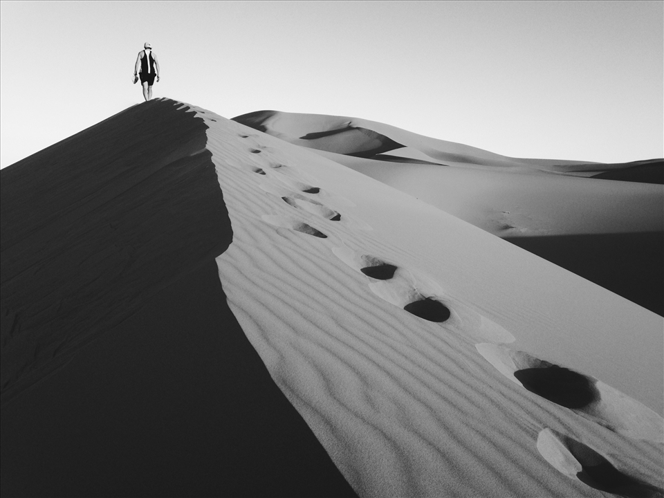 Climbing one the many 350 ft. high sand dunes near Merzouga, Morocco.