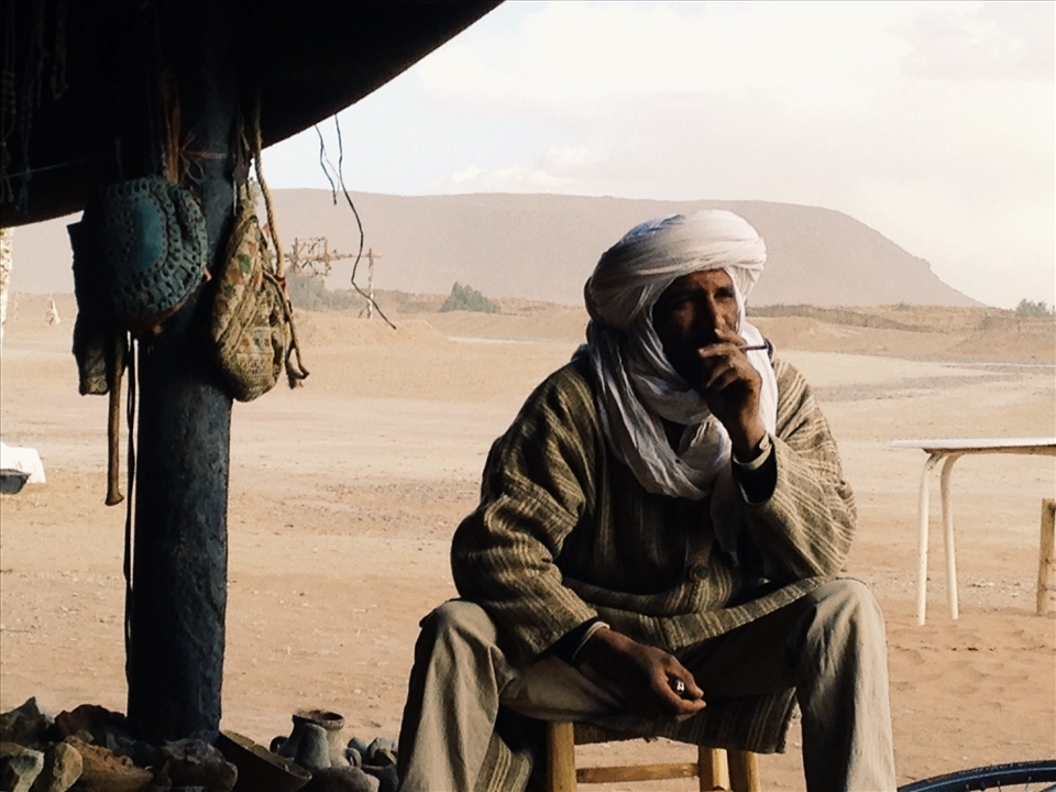 Enjoying shelter and tea during in a bedouins hut during a sandstorm