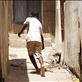 A young boy hoop rolling through the alleys of Lamu, Kenya's old town.  by: mattsjournal Views[254]