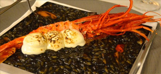 Presentation detail: the shrimp and the alioli on the top of the black rice