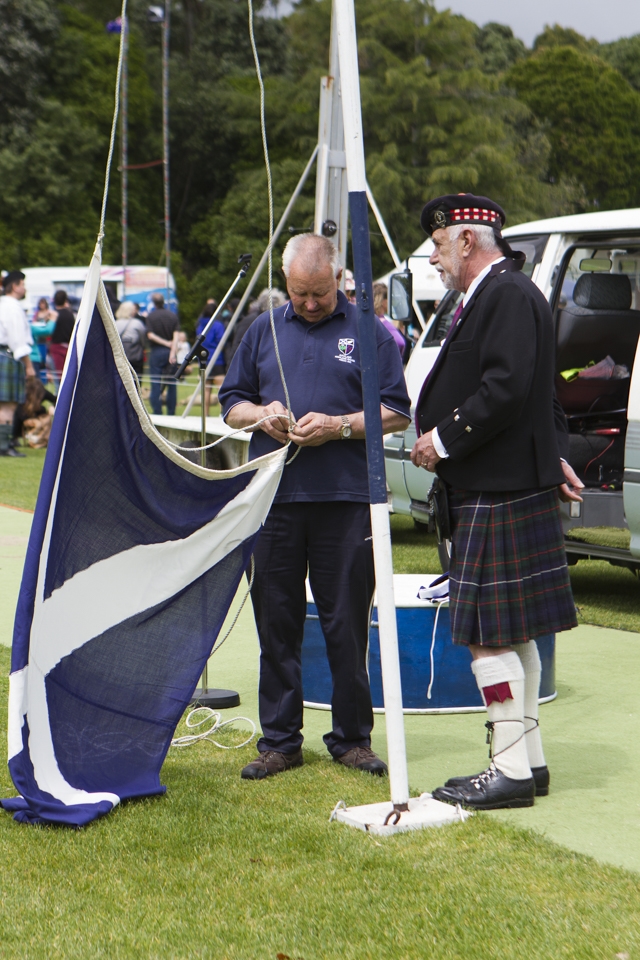 The Scottish Flag is prepared under the watchful eye of the Master of Ceremonies