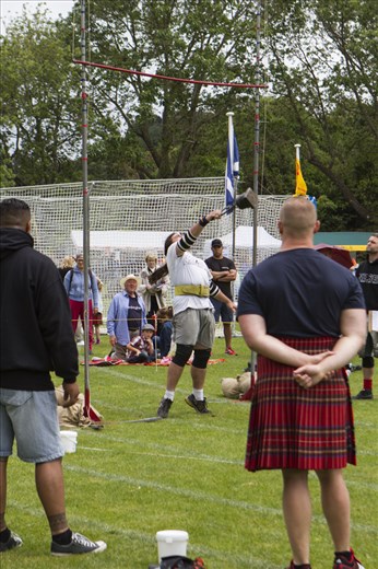 Traditional Scottish strong man events - hurling weights over the high bar