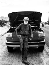 Old man waiting for his truck to be repaired in the Wonder Valley (California)

Here is a great example of the natural cinematographic mood that you will find in the west of USA. On this road who seems to have no end, only the wind can break the silence, and this man wait, maybe for hours under 45°C, quietly drinking his cup of coffee in the middle of this no man's land. : by mdl38, Views[468]