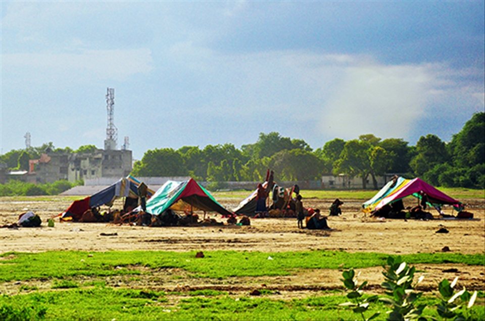 Informal settlers set up tents on tracts of unoccupied land and call them home.