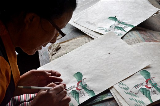 Woman paints another but world will see only painted one, I chose to shoot both.