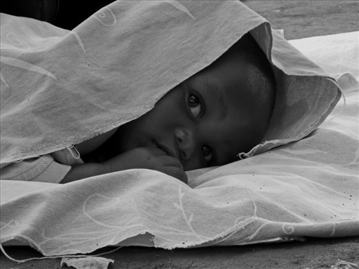Nap time: Baby Nicholas wakes from his nap in the heat of the day