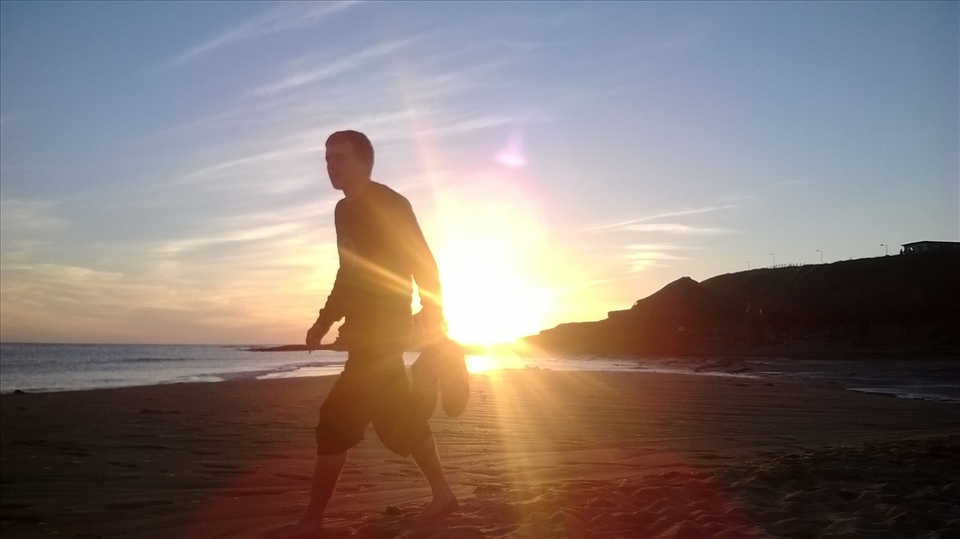 My friend walking by the beautiful sunset in Co.Donegal.