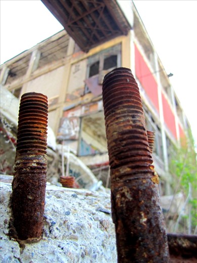 Even large structures and societies are built with small solid parts such as these bolts, in this once active Detroit Packard Plant. No matter how small, each individual part has its place in building the whole. In fact, the seemingly small parts are of great significance. They anchor.