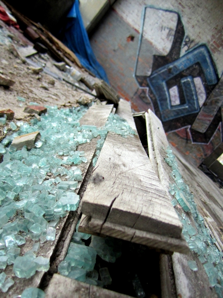 Detroit's now abandoned Packard Plant once manufactured automobiles. The damaged boards and glass of a shattered past does not have to remain that way. Detroit's rejuvenation awaits.