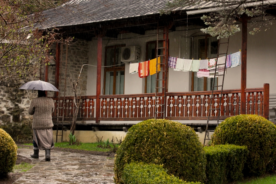Moldavia is known as the most religious region of Romania because of the many monasteries and churches. 
Sihastria Monastery in Neamt County is located in a natural beautiful landscape surrounded by forests. The monastery administrates several hermitages that are more and more visited by pilgrims and some tourists. It was a rainy day when I visited it and the wet tiles, the sound of the rain and the religious chants coming from the cemetery introduced me into a soft atmosphere. 
However, the sight of clothes hanging out to dry in front of monks' houses reminded me of everyday life's necessities.