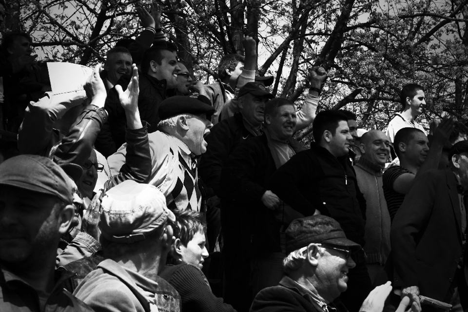 The curiosity of discovering how much importance is given to soccer in Moldavia, led me to the stadium in Iaşi to see the match of Iaşi vs Bacau. I sincerely didn't pay much attention to the game but focused on the expression of disappointment or joy of the audience. A singular tradition is to eat sunflower seeds and to throw their shells on the floor while watching the game. 
This scene was taken during the definitive goal by the Iaşi team.
