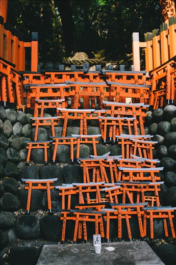 The road through Fushimi Inari Shrine is littered with smaller shrines along the way, decorated with these miniature red torii gates left by visitors.