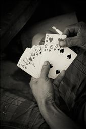 A cross cultural connection - Cards. Amazing how where ever your are playing cards is great way to pass the time. I was walking around the fishing village and snapped this picture of one mans hand of cards. They were waiting for the fishermen to come back from being out to sea.: by melis2117, Views[438]