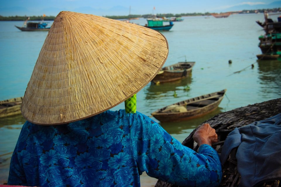 The morning calm as the sun rises before the fishermen come back. She was waiting for her husband, and was hoping for a abundance of  fish which was going to support fixing their roof as it was damaged in a recent storm.  