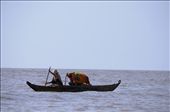 Tonle Sap Lake. January. 2013. Mother and baby under makeshift canopy.It was the first boat I saw on the horizon as we neared the fishing village.: by melissag, Views[284]