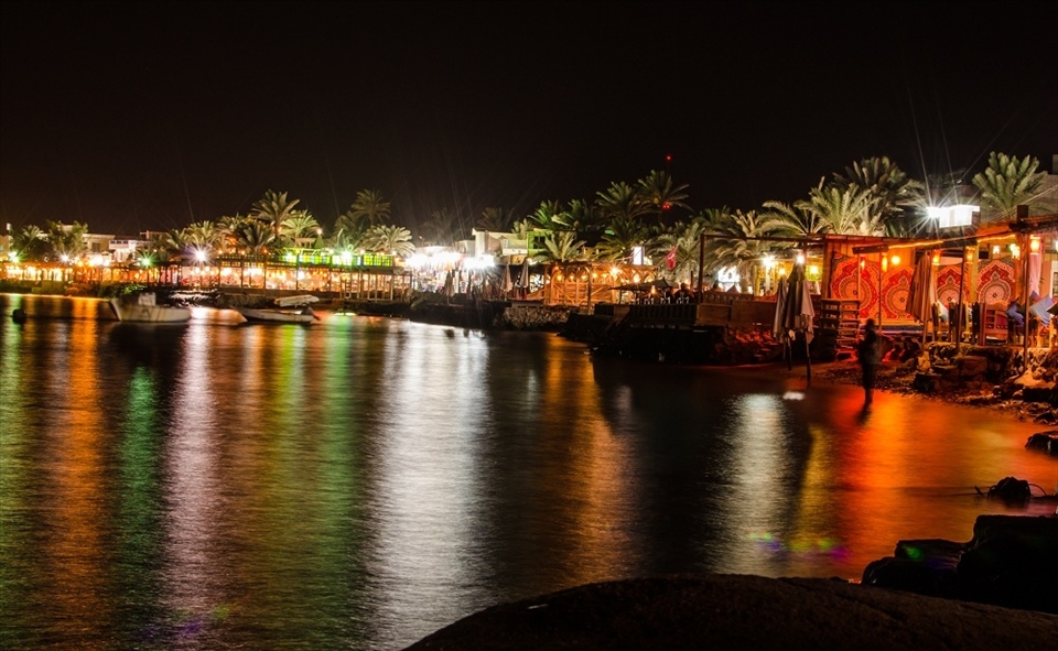 Dahab city lights: Dahab is really quite city, that is a typical summer night on its shore, with many available quite sea view cafes, you can enjoy your summer night and have a drink peacfully as there is no rush.

Dahab is a quite small city in south Sinai, it is a touristic attraction for all nature lovers, and these 5 photos are not pure nature photos! they all have some human touch, telling the story of the enormous peacefully beautiful nature enclosing and containing the limited and balanced human manipulation; opposite to what we see in urban areas and huge modern cities - where we cannot watch stars, or sunset, or even enjoy a quite time!
