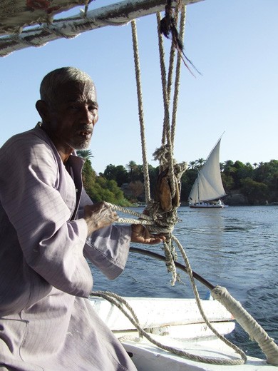 Working on sailing boats, which transfer tourists to the Temple Philae, near of Aswan, is one of the job opportunities for Egyptians created by the tourism on the Nile.