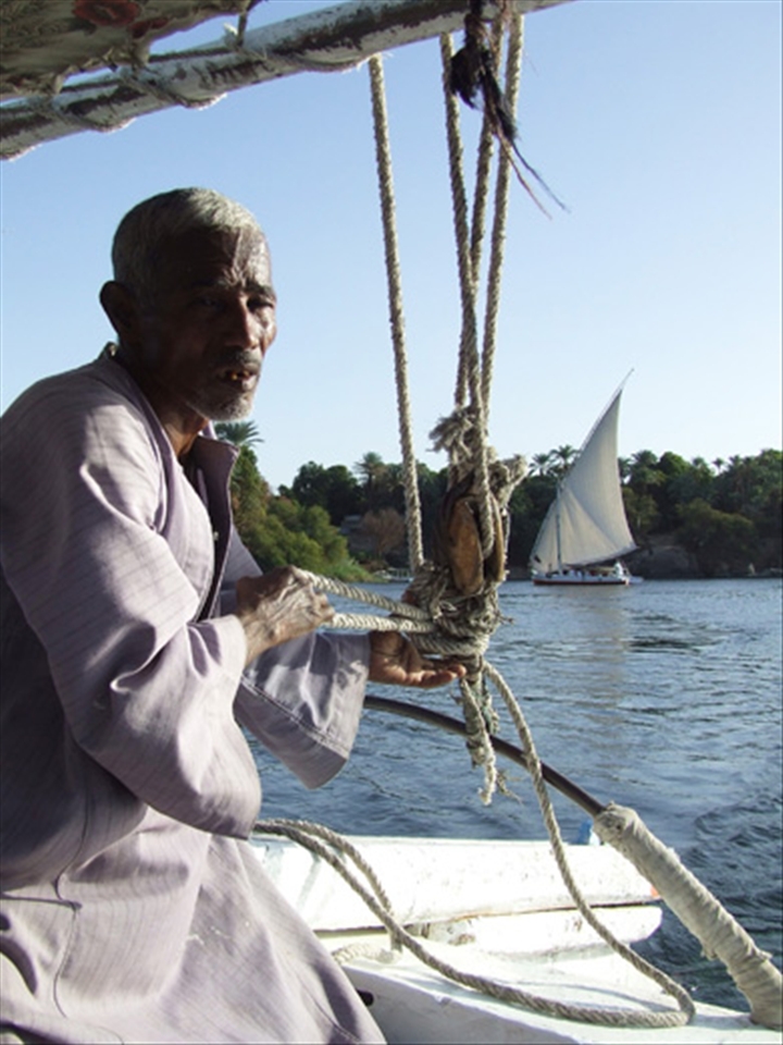 Working on sailing boats, which transfer tourists to the Temple Philae, near of Aswan, is one of the job opportunities for Egyptians created by the tourism on the Nile.