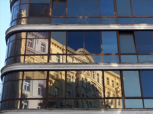 The reflection of history in a building that will soon cease to exist.