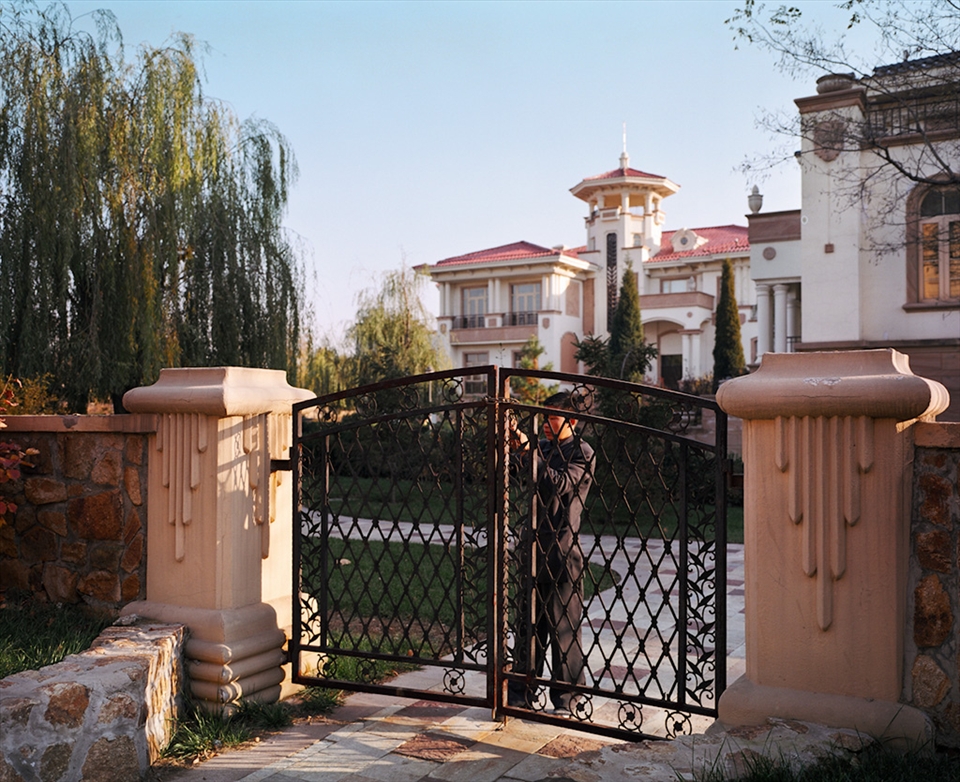 The unlikely guardians of Jing Jin's thousands of deserted properties are teenage security guards, firm but polite in keeping visitors out of abandoned private property. Visitors are a rare sight in this sleepy city and it's hard to tell who's more curious: the inquisitive photographer or the bored guard.