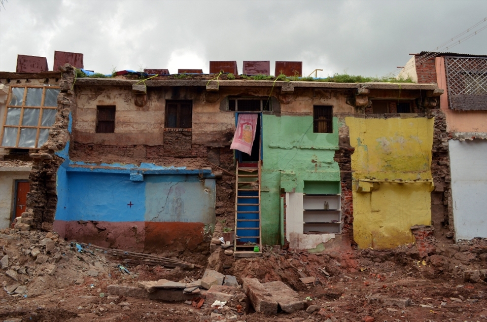 On the edge of destruction are the homes fortunate enough to lie just shy of the demolition zone. 