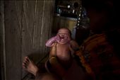 A six days old baby with a bath using water from the polluted rivers. Deforestation, coal mining and disposal of industrial waste streams contaminated all. Yet the indigenous has no other alternative sources. In the middle of the water crisis, people are forced to use polluted river water to meet their needs.: by michaeleko, Views[1691]