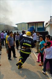 A fireman runs to the building to assist those already fighting the blaze.: by michaelt, Views[245]